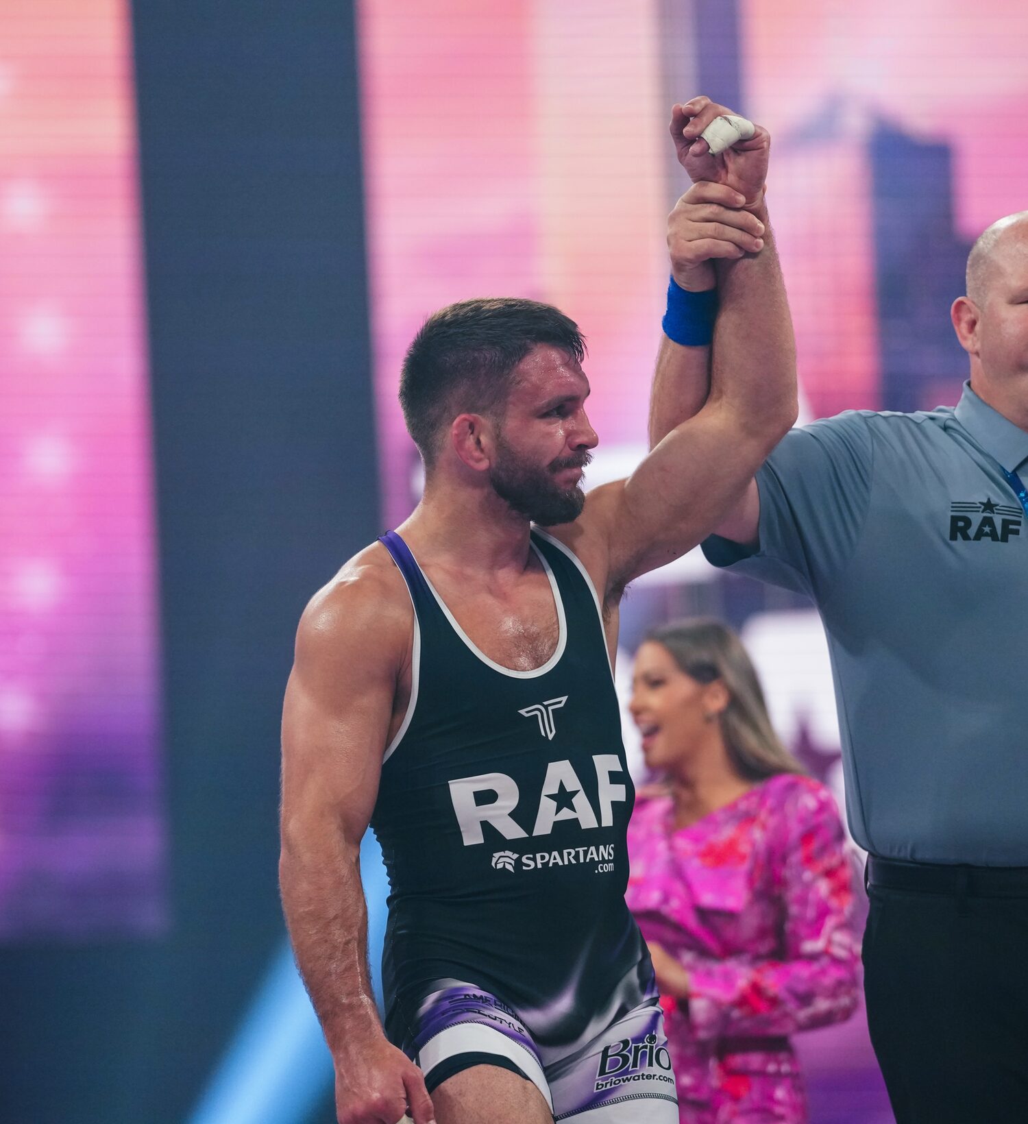 Zain Retherford has his hand raised after a Real American Freestyle win