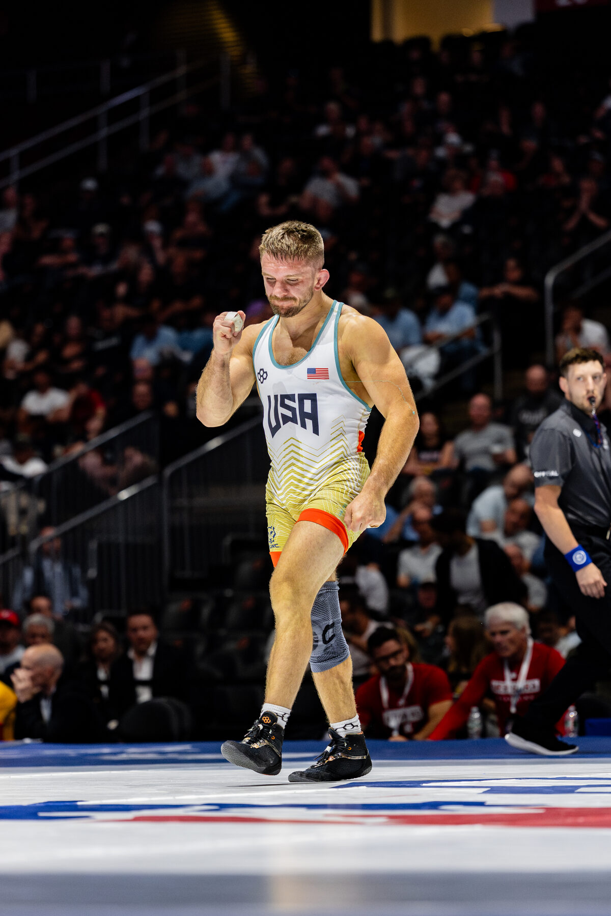 Zain Retherford celebrates a win in his USA singlet