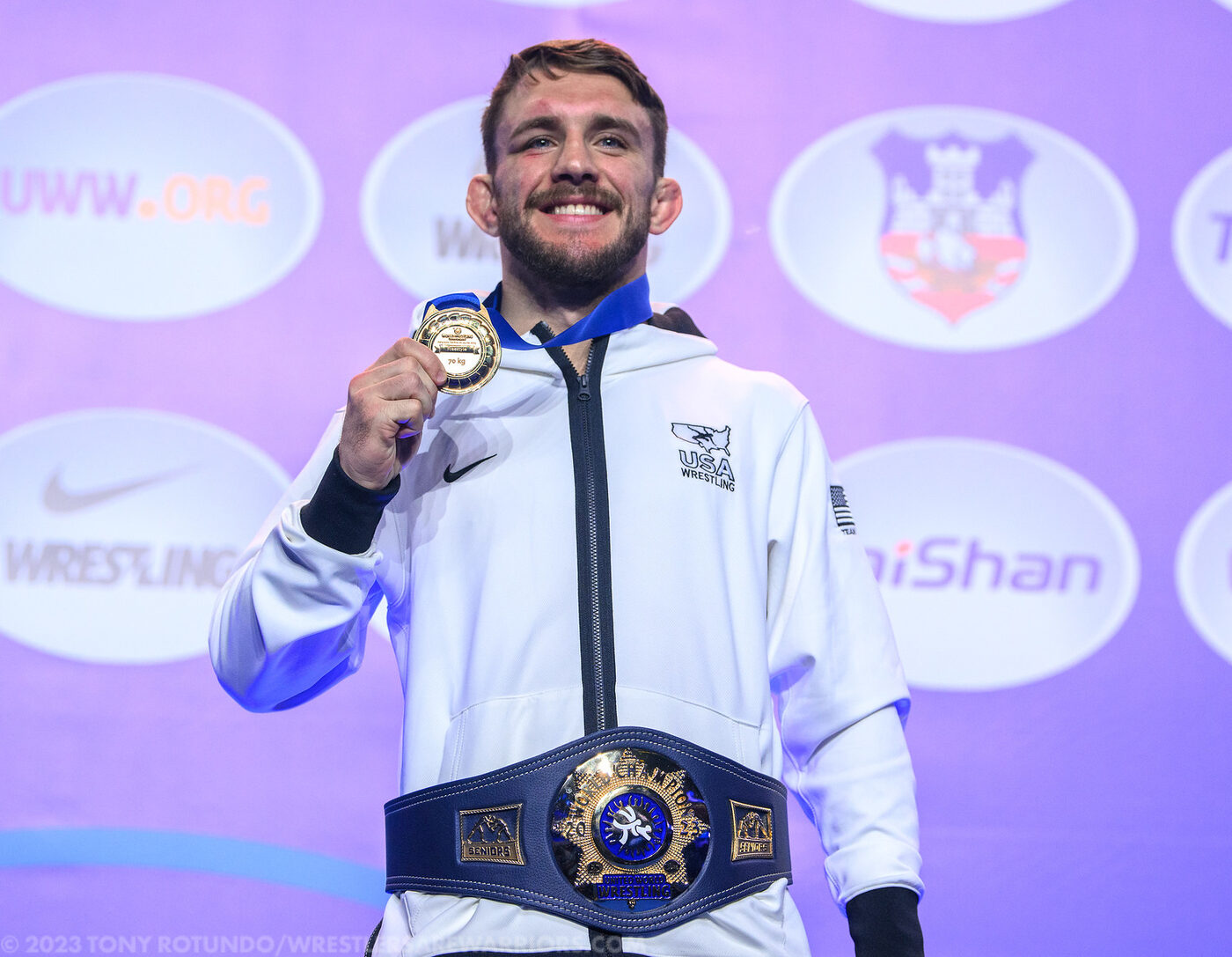 Zain Retherford with his World Championship gold medal and belt